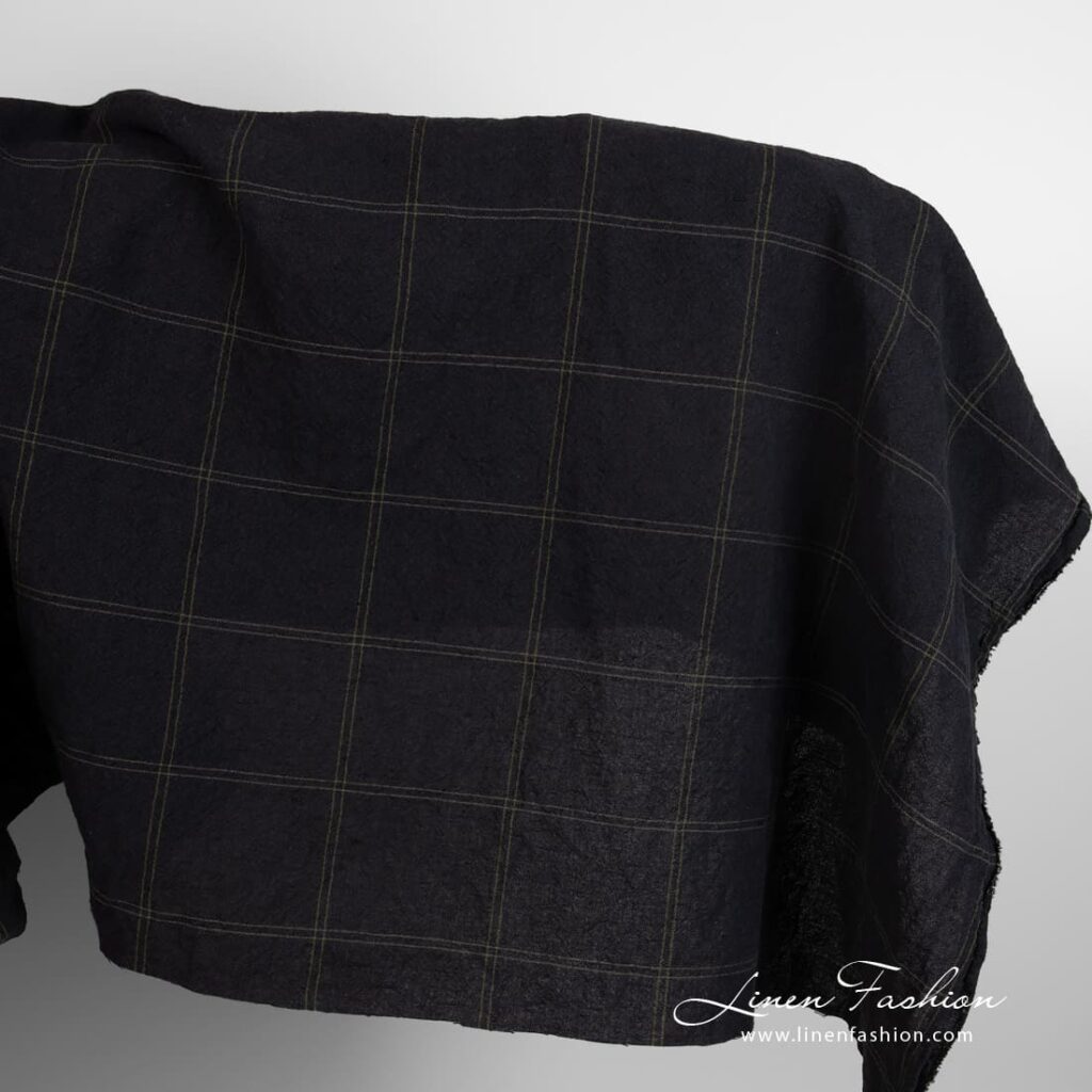 Wide black linen cotton fabric in green checks