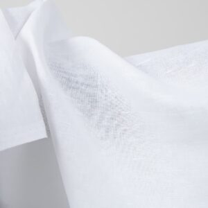 Optical white linen cotton fabric close up detail