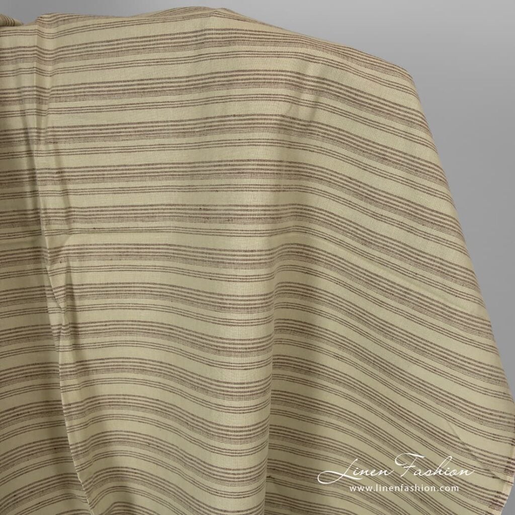 Pale green linen cotton fabric with brown stripes.