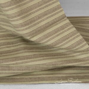 Pale green dyed linen cotton fabric.