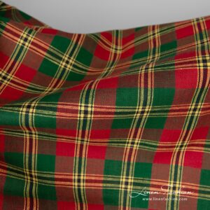 Linen / cotton fabric features a pattern consisting of criss-crossed horizontal and vertical bands of red, green and yellow colours