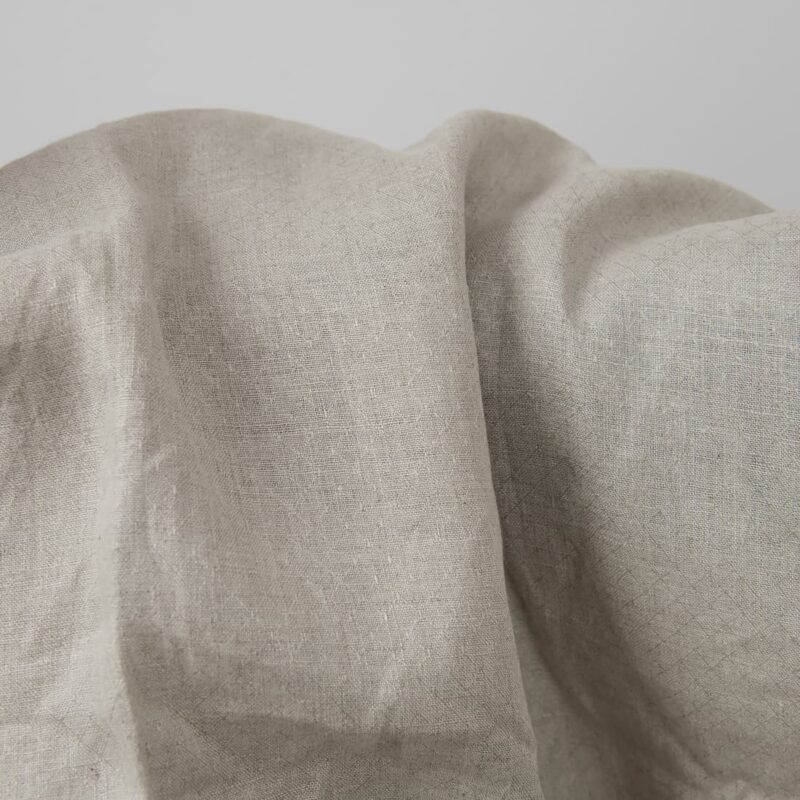 Grey patterned pure linen fabric close up detail