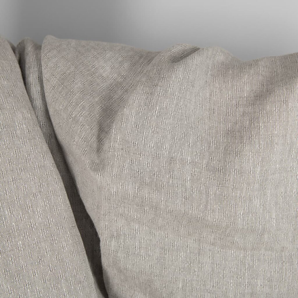 Openwork patterned linen fabric in beige close up detail