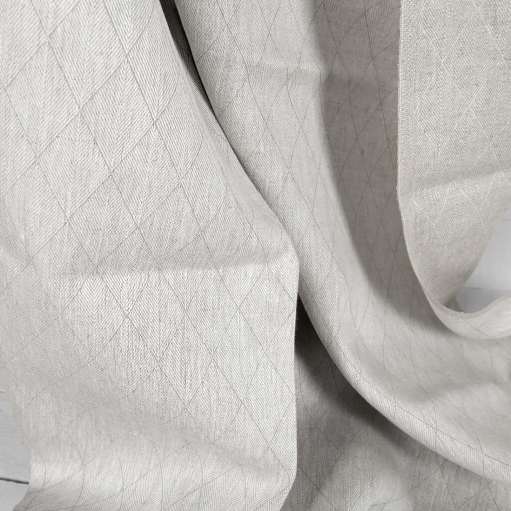 Beige double-sided linen fabric in a diamond pattern texture