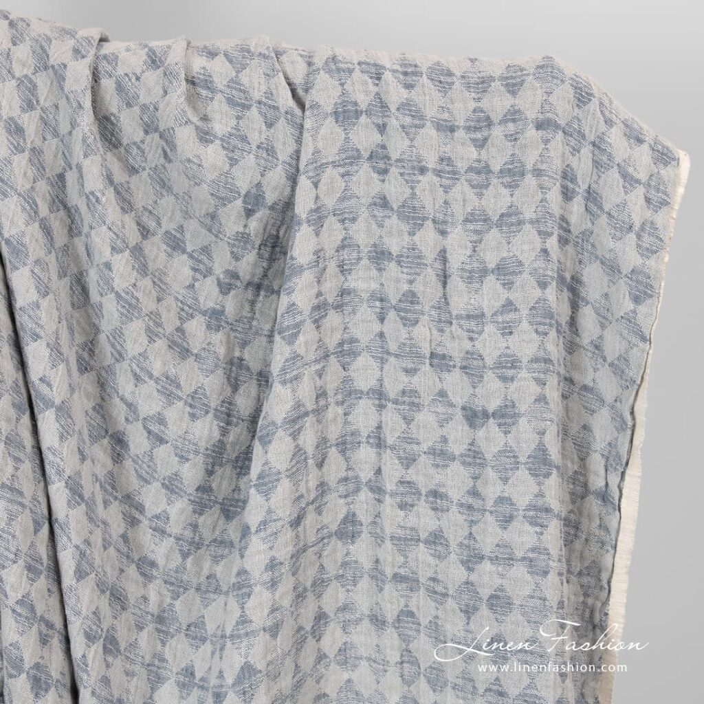 Linen cotton fabric in grey rhombus washed.