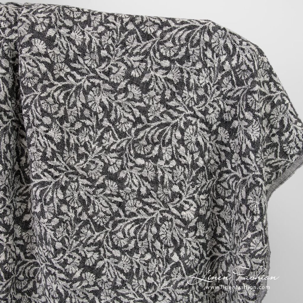 Black linen cotton jacquard fabric with flowery ornaments, washed
