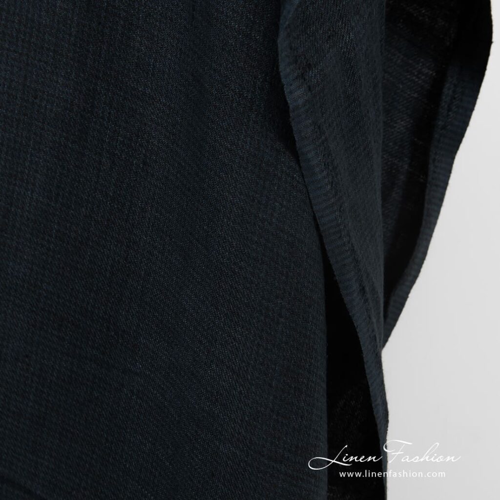 Dark blue linen fabric in twill weave and barely visible checks, specially washed