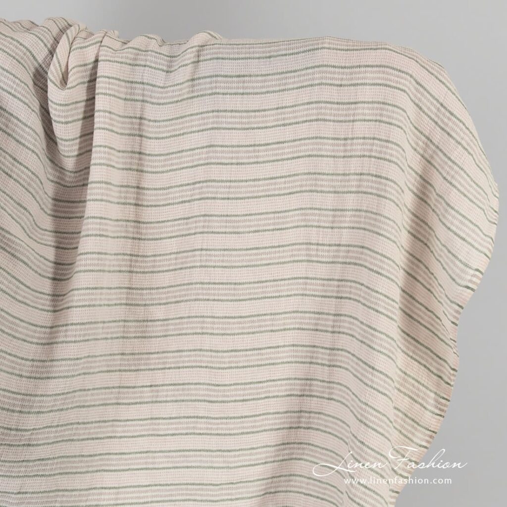Striped rosy linen fabric in waffle pattern