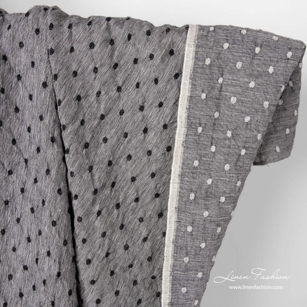 Black white linen wool fabric with dots.