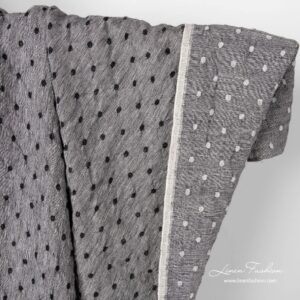 Black white linen wool fabric with dots.