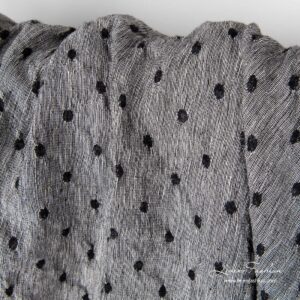 Washed black white linen wool fabric.