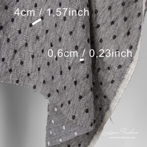 Washed black white fabric with dots.