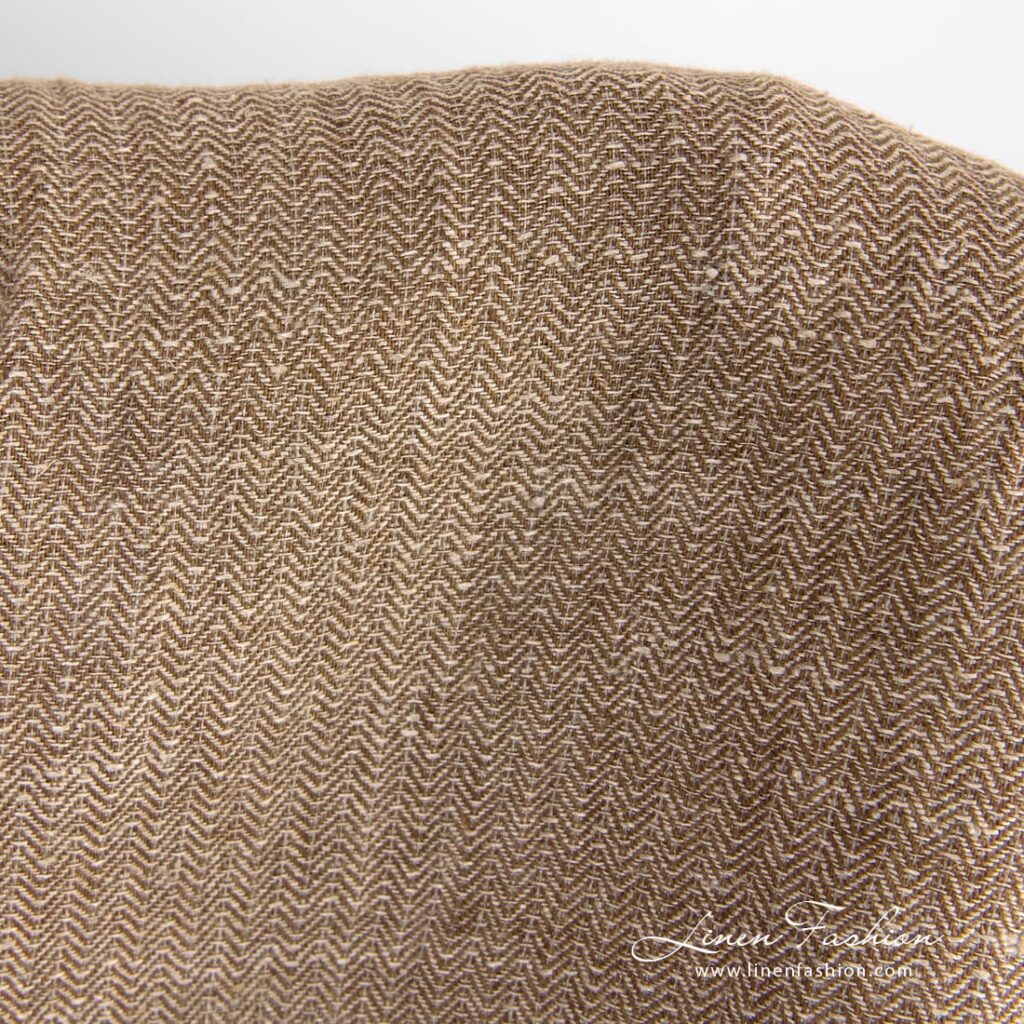 Brown linen fabric in herringbone pattern