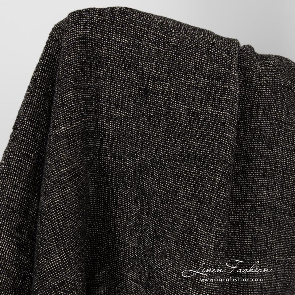 Washed linen fabric in black and flax melange.
