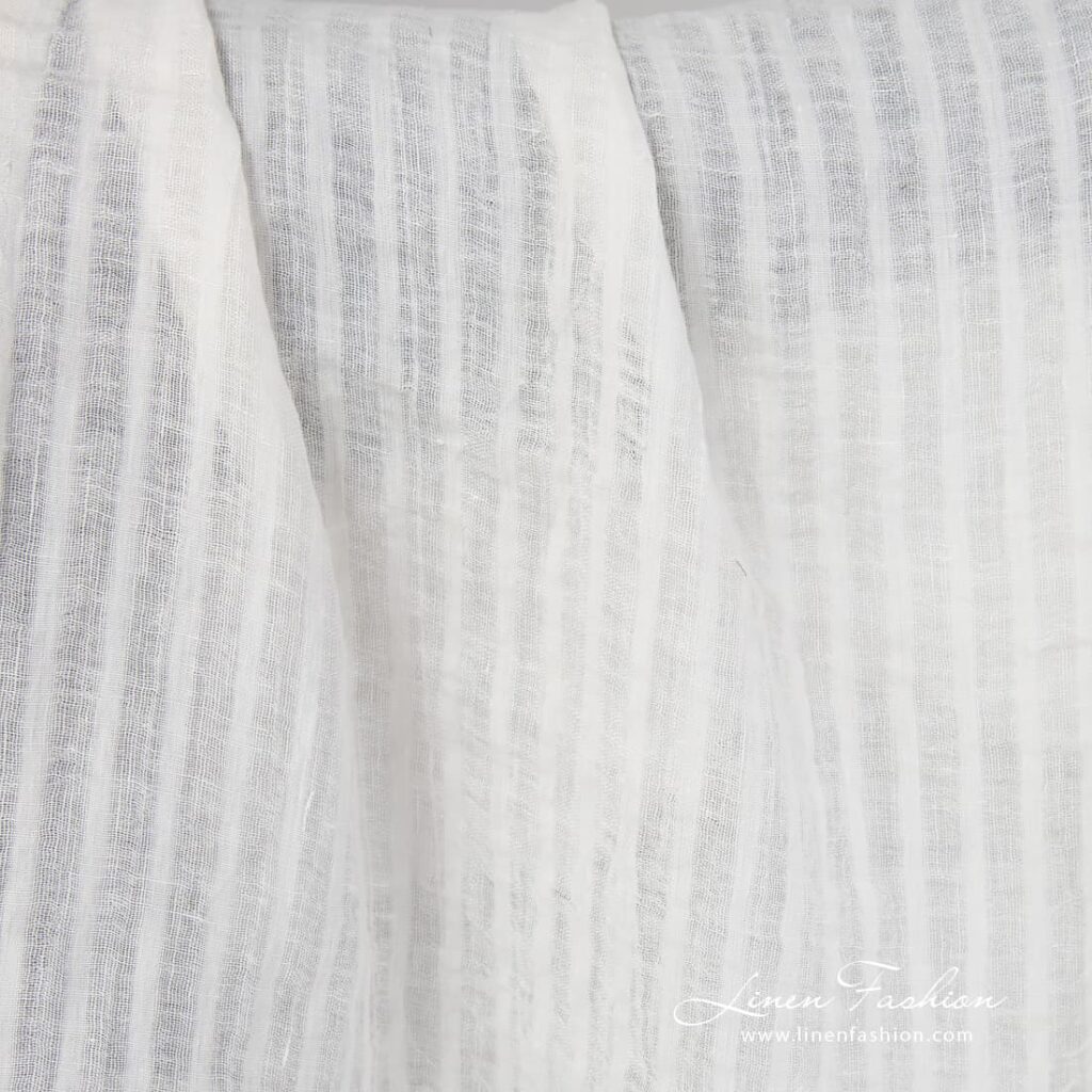 Off white linen fabric in stripes.