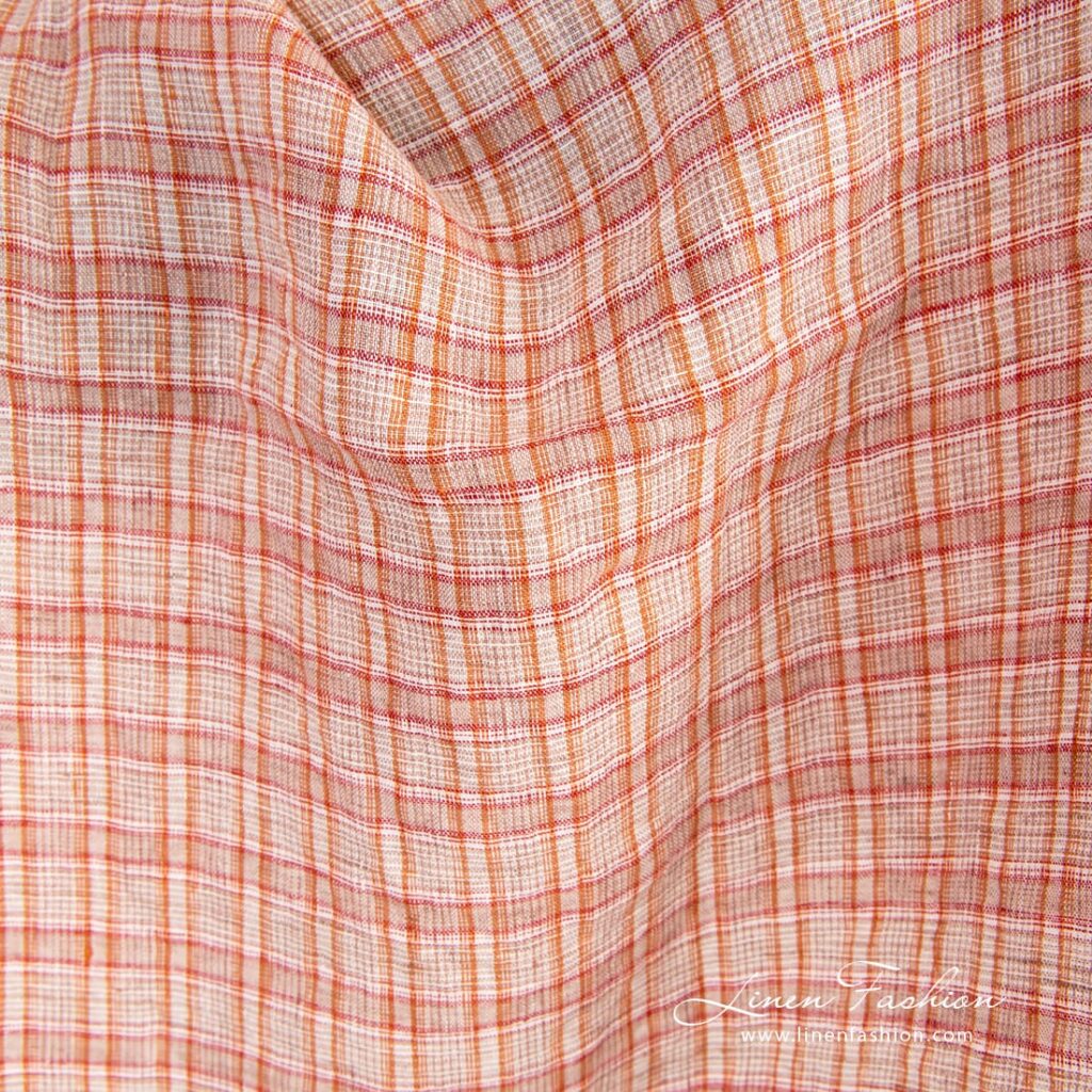 Orange linen fabric in checks, specially washed to increase softness