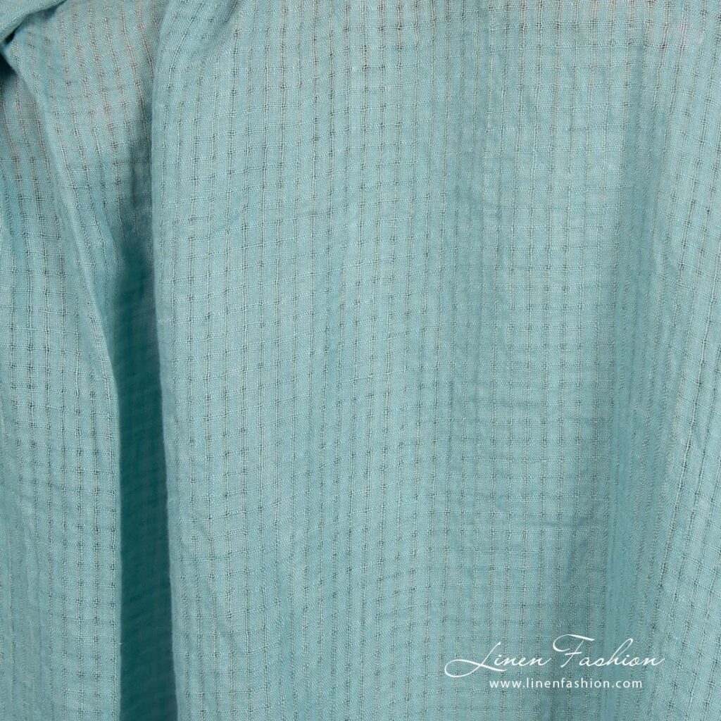 Blue green linen fabric in transparent checks, specially washed