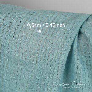 Linen fabric in transparent checks, woven from blue green yarns