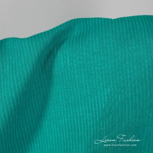100% linen fabric in green color.