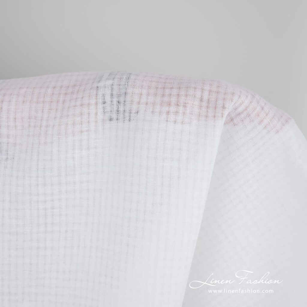 Optical white linen fabric in transparent checks, perfect for shawls, scarves, tablecloths and curtains
