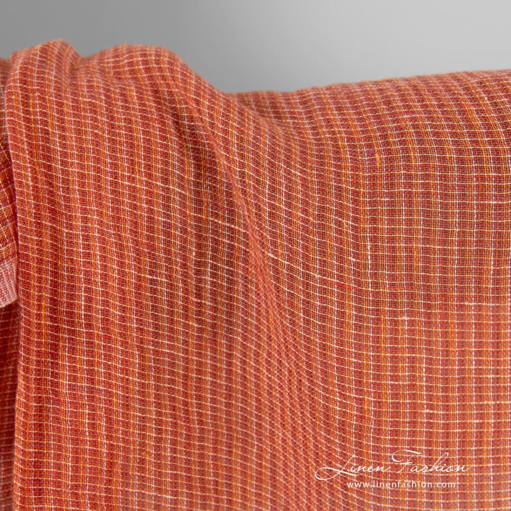 Transparent linen fabric in orange melange, specially washed