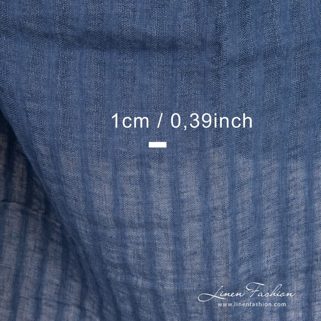Blue linen fabric with openweave vertical stripes, washed
