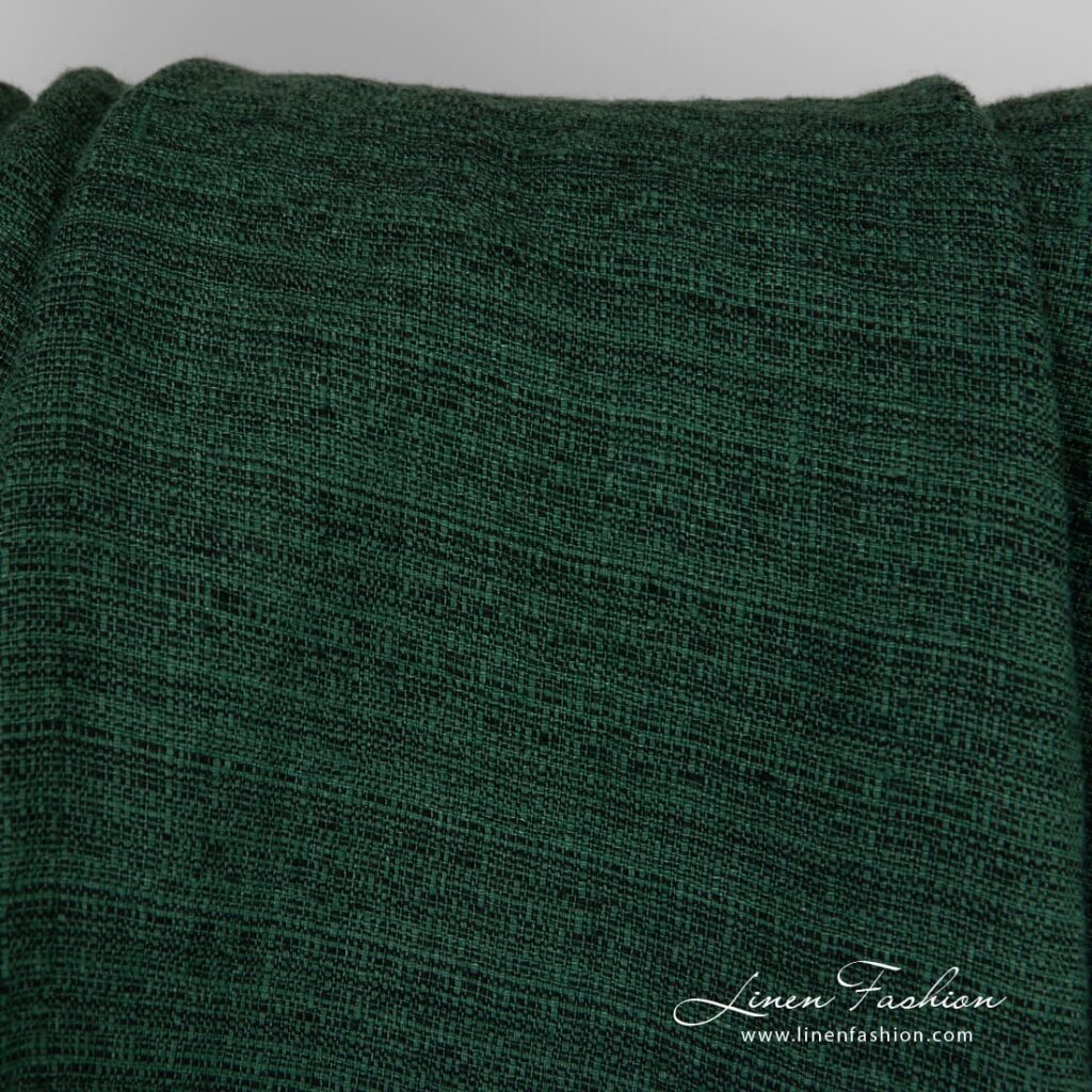 Forest green linen fabric in tweed pattern