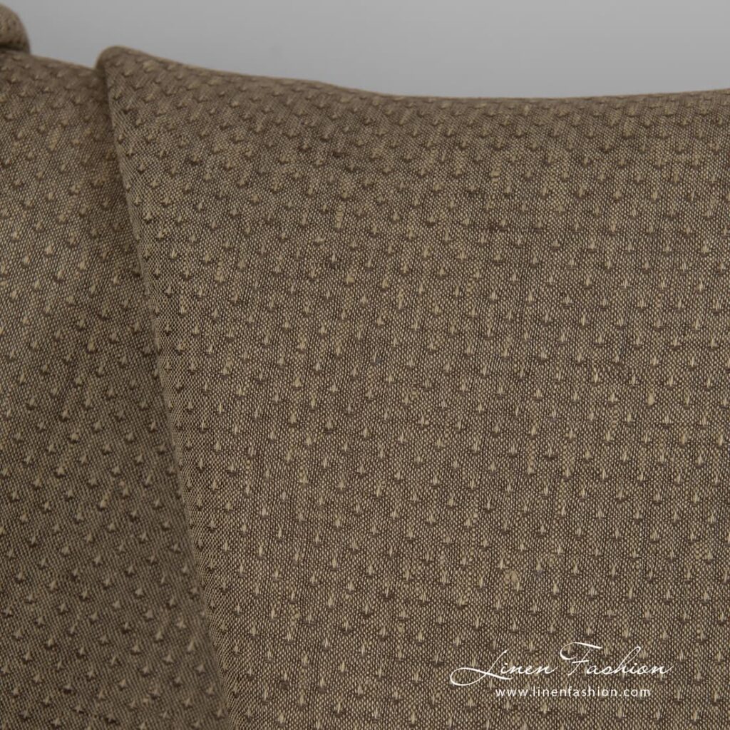 Brown dyed linen fabric with spots.