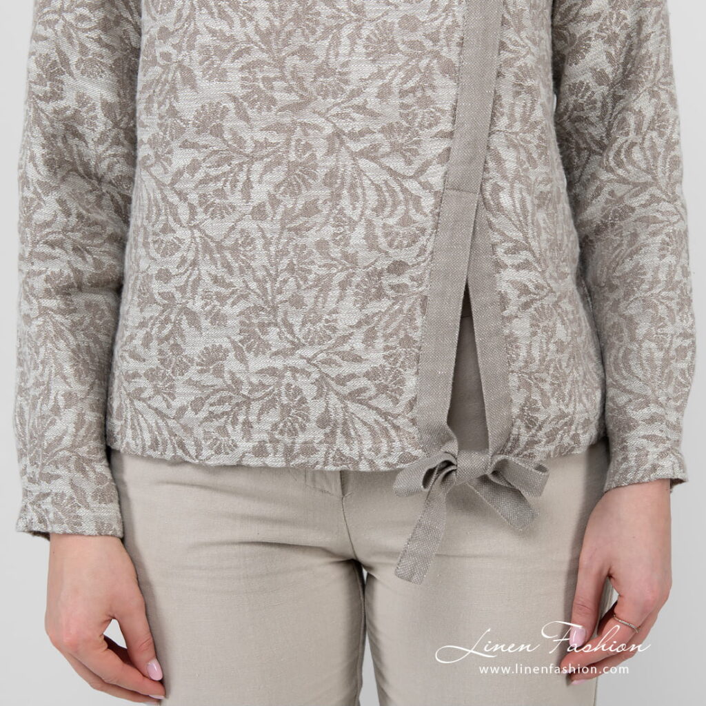 linen cotton beige jacquard blouse with ribbon at bottom.