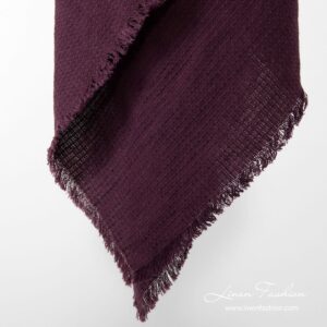 Dark red colored linen-cotton scarf.